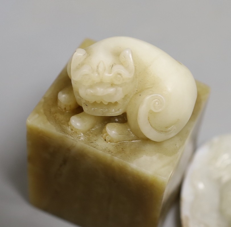A Chinese hardstone seal and a luohan carving, 13cm tall, (2)